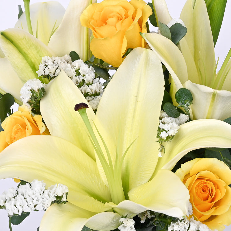 yellow roses and white lilies Forrest Glow